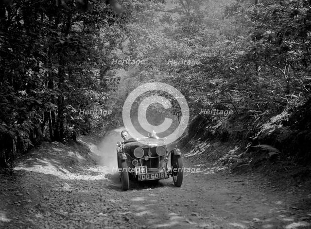 MG J2 taking part in the B&HMC Brighton-Beer Trial, Fingle Bridge Hill, Devon, 1934. Artist: Bill Brunell.
