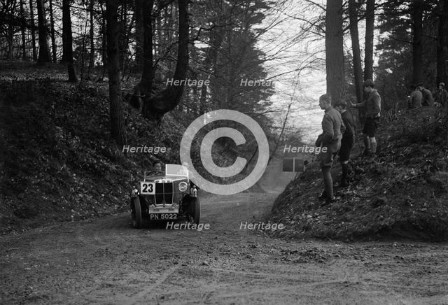 MG M Type standard 2-seater competing in the JCC Half-Day Trial, Hurtwood Hill, Surrey, 1930. Artist: Bill Brunell.