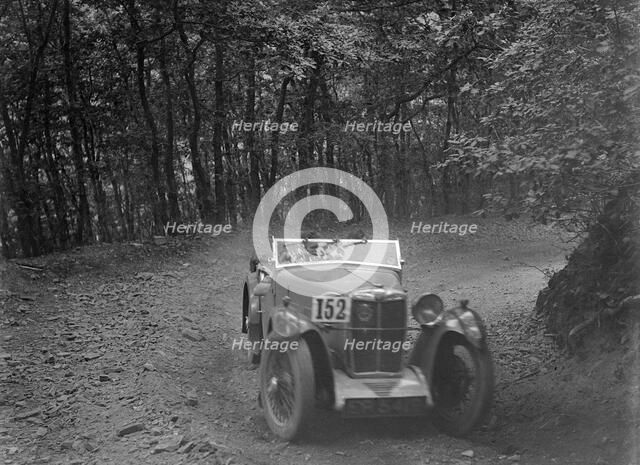MG Magna competing in the B&HMC Brighton-Beer Trial, Fingle Bridge Hill, Devon, 1934. Artist: Bill Brunell.