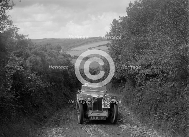 MG Magna competing in the Mid Surrey AC Barnstaple Trial, 1934. Artist: Bill Brunell.