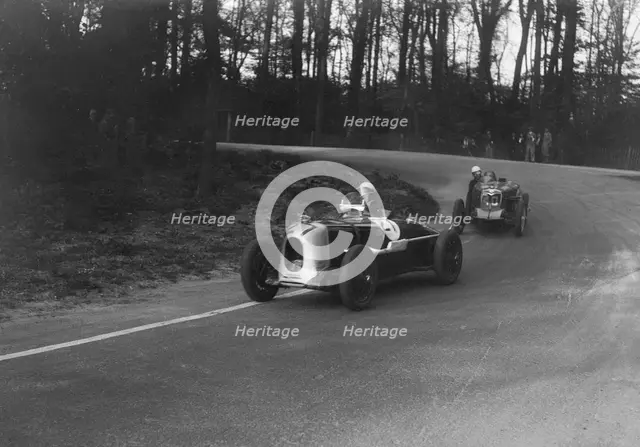 MG Magnette of AA Rigby leading JR Grice's Riley Brooklands at Donington Park, Leicestershire, 1935. Artist: Bill Brunell.