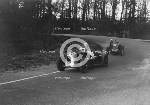 MG Magnette of AA Rigby leading JR Grice's Riley Brooklands at Donington Park, Leicestershire, 1935. Artist: Bill Brunell.