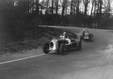 MG Magnette of AA Rigby leading JR Grice's Riley Brooklands at Donington Park, Leicestershire, 1935. Artist: Bill Brunell