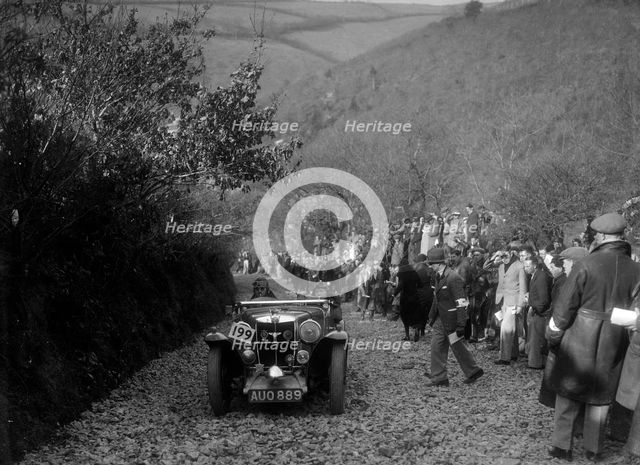 MG Magnette of JW Fox competing in the MCC Lands End Trial, Beggars Roost, Devon, 1936. Artist: Bill Brunell.