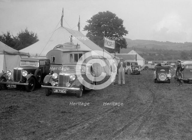 MG SA and MG 18/80 at Shelsley Walsh, Worcestershire, during the Blackpool Rally, 1937.  Artist: Bill Brunell.