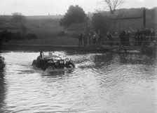 MG PA driving through a ford during a motoring trial, 1936. Artist: Bill Brunell