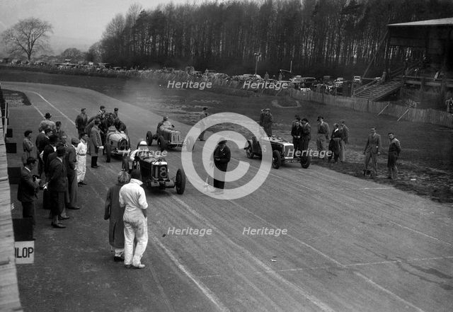 MG Q type, Frazer-Nash Shelsley and Bugatti Type 51 on the starting grid at Donington Park, 1930s. Artist: Bill Brunell.