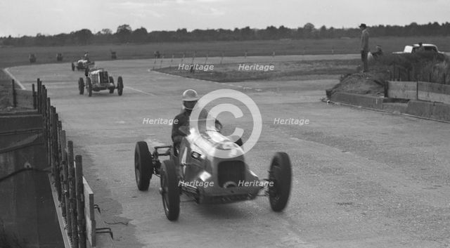 MG racing at Brooklands, Surrey, c1930s. Artist: Bill Brunell.