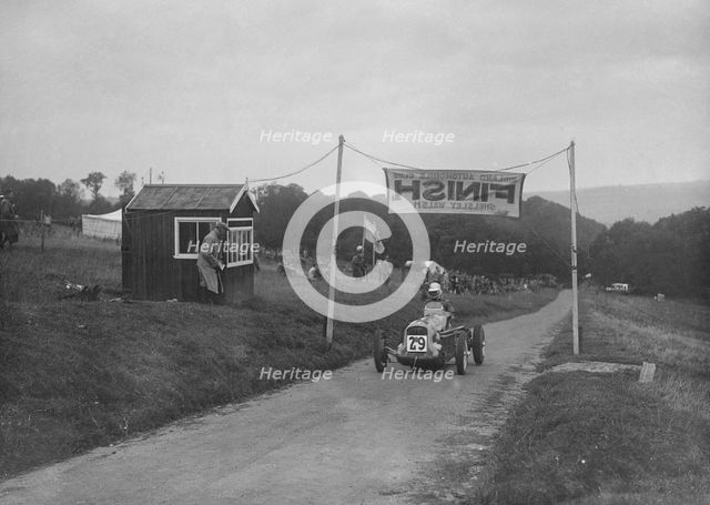 MG racing single-seater at the finish of the Shelsley Walsh Hillclimb, Worcestershire, 1935. Artist: Bill Brunell.