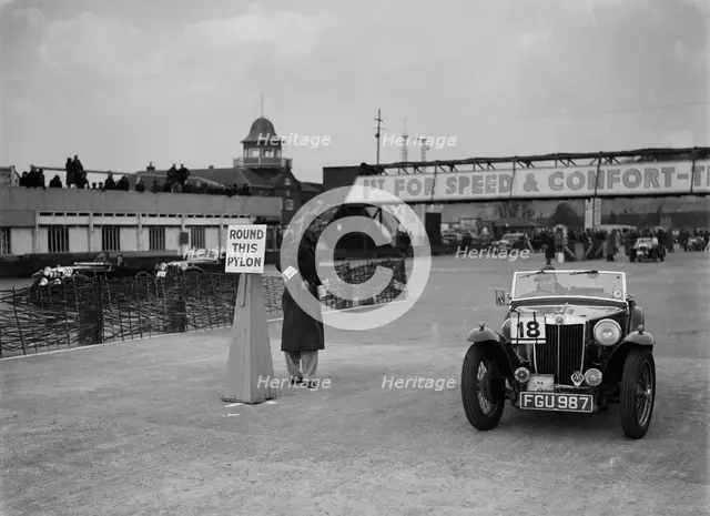 MG TA competing in the JCC Rally, Brooklands, Surrey, 1939. Artist: Bill Brunell.
