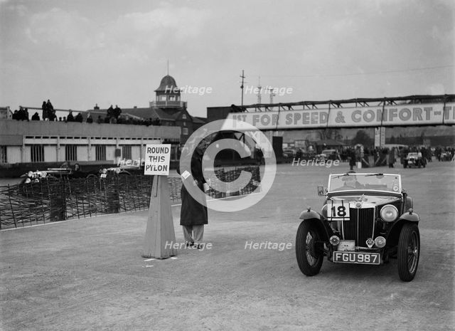 MG TA competing in the JCC Rally, Brooklands, Surrey, 1939. Artist: Bill Brunell.