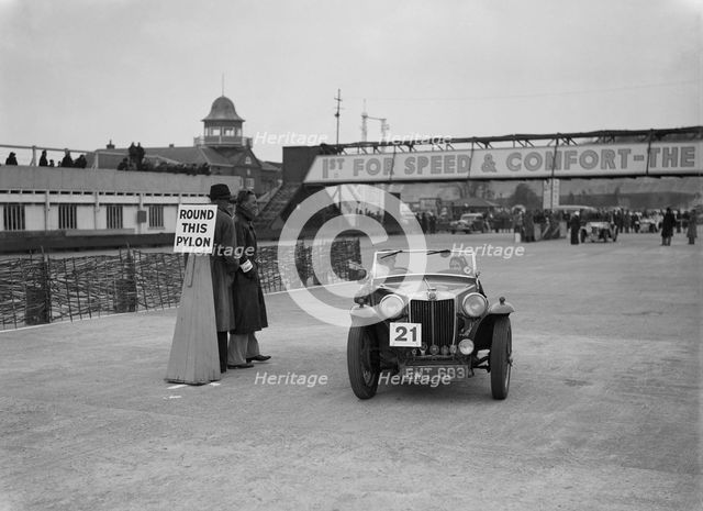 MG TA competing in the JCC Rally, Brooklands, Surrey, 1939. Artist: Bill Brunell.