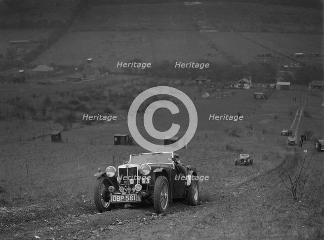 MG TA competing in the London Motor Club Coventry Cup Trial, Knatts Hill, Kent, 1938. Artist: Bill Brunell.