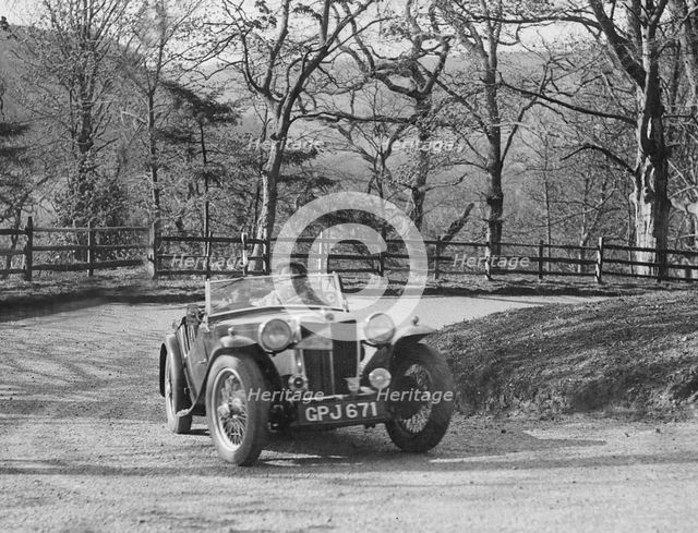 MG TA of FW Ellis competing in the RAC Rally, 1939. Artist: Bill Brunell.