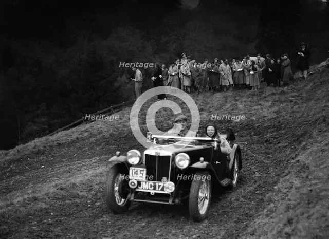 MG TA of H Stevens competing in the MCC Edinburgh Trial, Roxburghshire, Scotland, 1938. Artist: Bill Brunell.