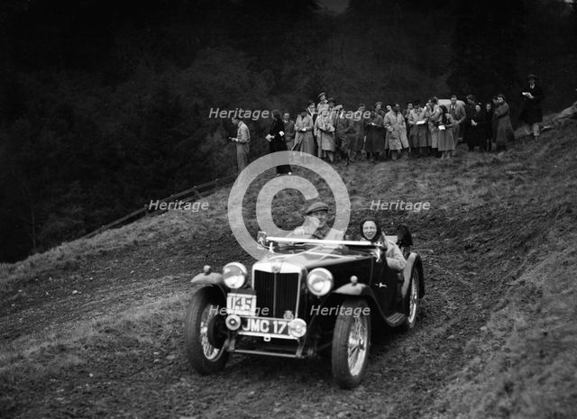 MG TA of H Stevens competing in the MCC Edinburgh Trial, Roxburghshire, Scotland, 1938. Artist: Bill Brunell.