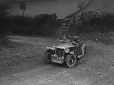 MG TA of HV Slade competing in the MG Car Club Midland Centre Trial, 1938. Artist: Bill Brunell