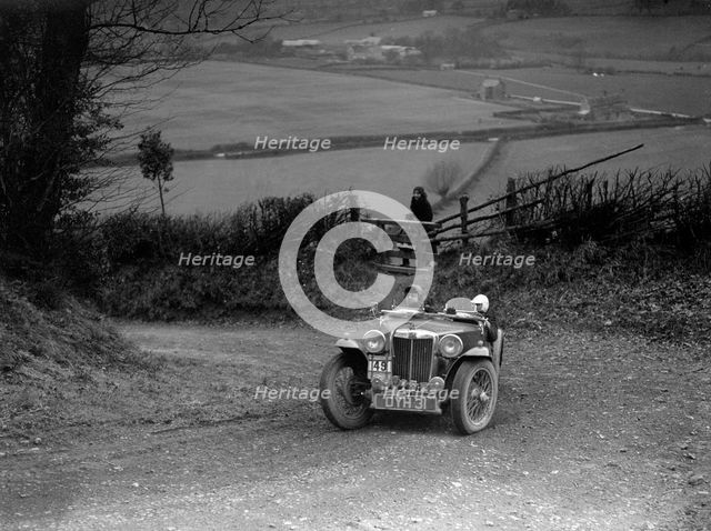 MG TA of JF Kingham competing in the MG Car Club Midland Centre Trial, 1938. Artist: Bill Brunell.