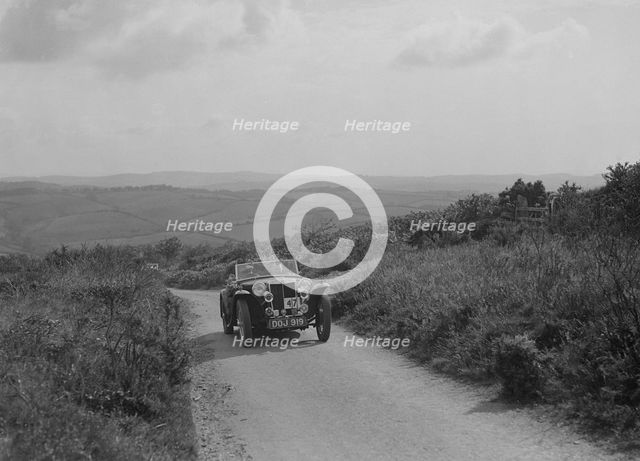 MG TA of JL Lutwyche competing in the MCC Torquay Rally, 1938. Artist: Bill Brunell.