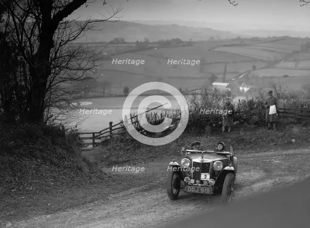 MG TA of JL Lutwyche competing in the MG Car Club Midland Centre Trial, 1938. Artist: Bill Brunell.