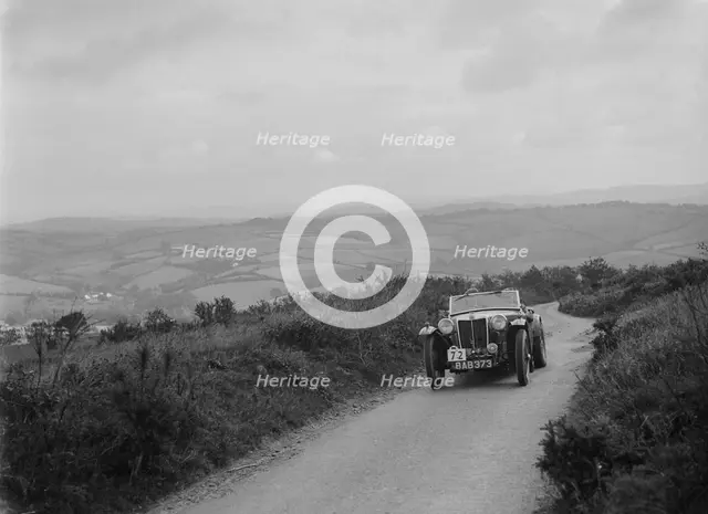 MG TA of NH Grove competing in the MCC Torquay Rally, 1938. Artist: Bill Brunell.