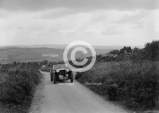 MG TA of RA MacDermid competing in the MCC Torquay Rally, 1938. Artist: Bill Brunell.