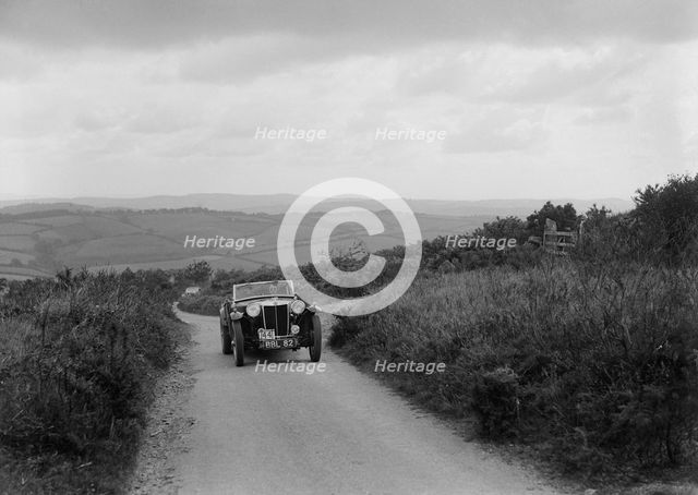 MG TA of RA MacDermid competing in the MCC Torquay Rally, 1938. Artist: Bill Brunell.