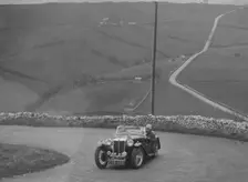 MG TA of WC Reid competing in the RAC Rally, 1939. Artist: Bill Brunell