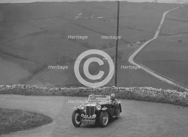 MG TA of WC Reid competing in the RAC Rally, 1939. Artist: Bill Brunell.