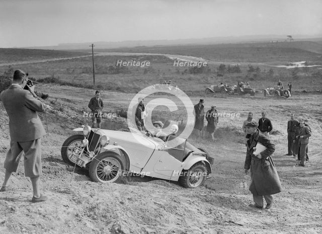 MG TA of the Cream Cracker Team competing in the Great Weat Motor Club Trial, 1938. Artist: Bill Brunell.