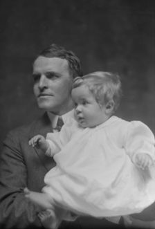 Mitchell, W.C., Mr., and baby, portrait photograph, 1914 May 22. Creator: Arnold Genthe