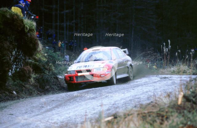 Mitsubishi  Lancer Evo,T.Makinen 1999 network q. Artist: Unknown.