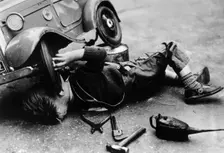 Michael Ware repairing his pedal car