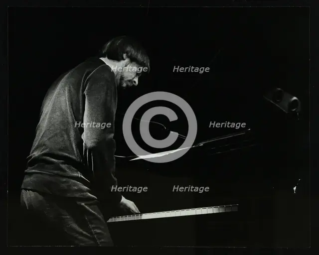 Michael Garrick on the piano at The Stables, Wavendon, Buckinghamshire. Creator: Denis Williams.