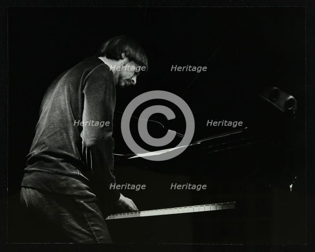 Michael Garrick on the piano at The Stables, Wavendon, Buckinghamshire. Creator: Denis Williams.