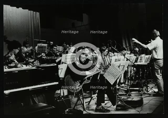 Michael Garrick conducting an orchestra at Berkhamsted Civic Centre, 1985. Creator: Denis Williams.