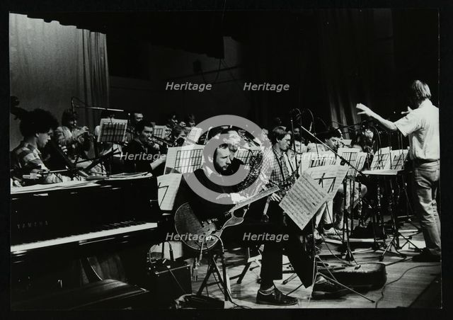Michael Garrick conducting an orchestra at Berkhamsted Civic Centre, 1985. Artist: Denis Williams