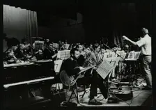 Michael Garrick conducting an orchestra at Berkhamsted Civic Centre, 1985. Creator: Denis Williams