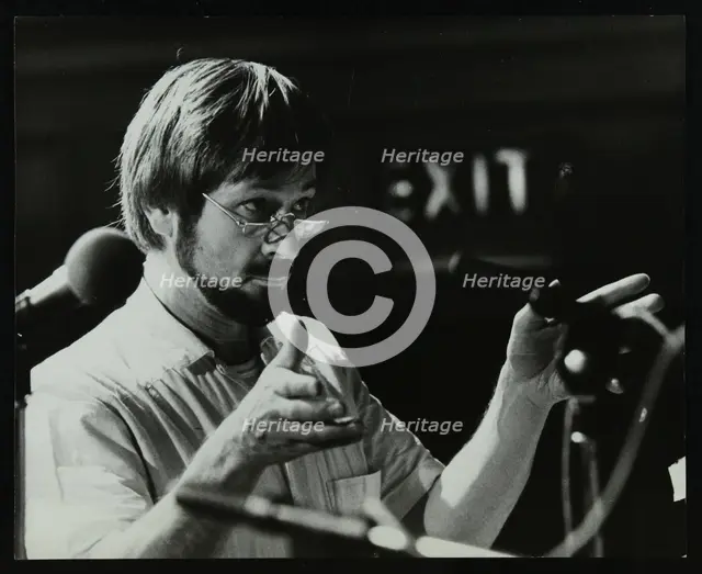 Michael Garrick conducting an orchestra at Berkhamsted Civic Centre, 1985. Creator: Denis Williams.