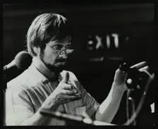 Michael Garrick conducting an orchestra at Berkhamsted Civic Centre, 1985. Creator: Denis Williams