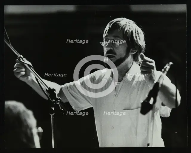 Michael Garrick conducting an orchestra at Berkhamsted Civic Centre, 1985. Creator: Denis Williams.