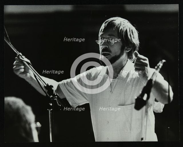 Michael Garrick conducting an orchestra at Berkhamsted Civic Centre, 1985. Artist: Denis Williams