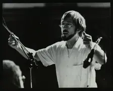 Michael Garrick conducting an orchestra at Berkhamsted Civic Centre, 1985. Creator: Denis Williams