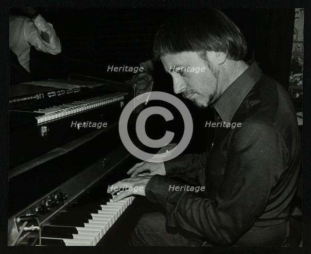 Michael Garrick playing the piano at The Bell, Codicote, Hertfordshire, 28 October 1980. Artist: Denis Williams