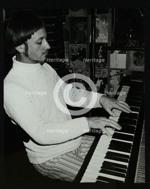 Michael Garrick playing the piano at The Bell, Codicote, Hertfordshire, 4 January 1981. Artist: Denis Williams
