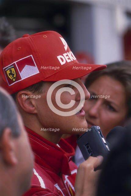 Michael Schumacher being interviewed, British Grand Prix, Silverstone, Northamptonshire, 1997. Artist: Unknown