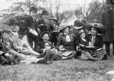 Midgets May Party - Central Park. Group seated on grass, 1910. Creator: Bain News Service