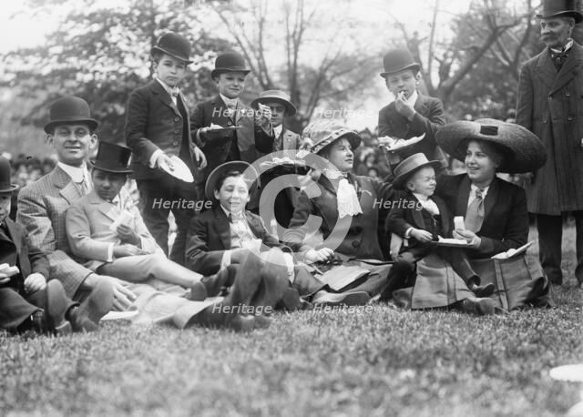 Midgets May Party - Central Park. Group seated on grass, 1910. Creator: Bain News Service.