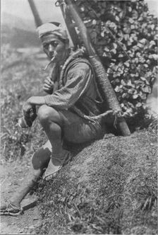 Middle-aged coolie hurriedly seated himself on the bank to pass us in review c1900, (1921). Artist: Julian Leonard Street