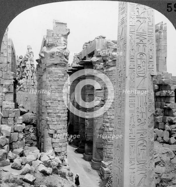 'Middle aisle of the great hall and obelisk of Thutmosis I, temple at Karnak, Thebes, Egypt', 1905.Artist: Underwood & Underwood